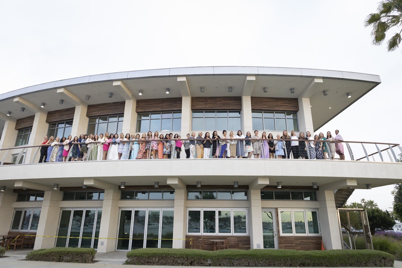 Junior League of Orange County members standing on a balcony